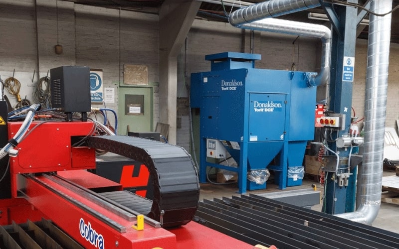 Donaldson Filtration System integrated with an Esprit CNC cutting table