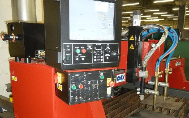 Used Cobra heavy-duty CNC plasma cutter with dual gas torches